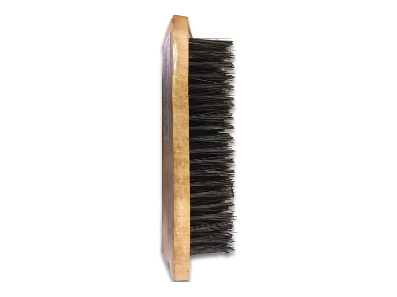 Wooden brush with black bristles